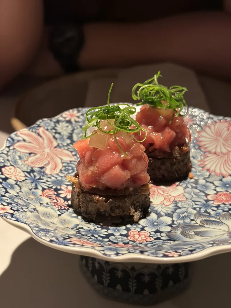 Tuna tartare appetizers on crispy rice cakes at Belimbing restaurant.